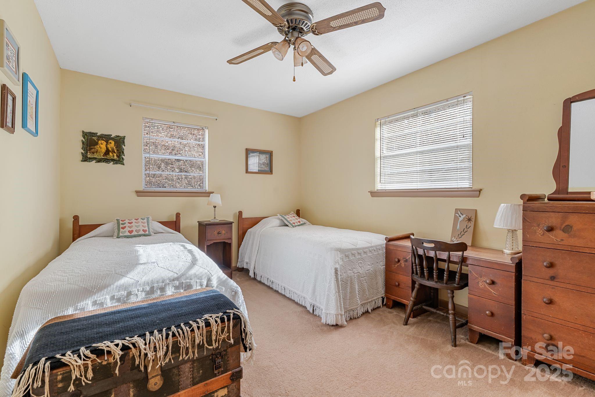 2650 Secluded Valley Road Marshall, NC 28753 - Photo 17 of 36 a bedroom with two beds and a desk