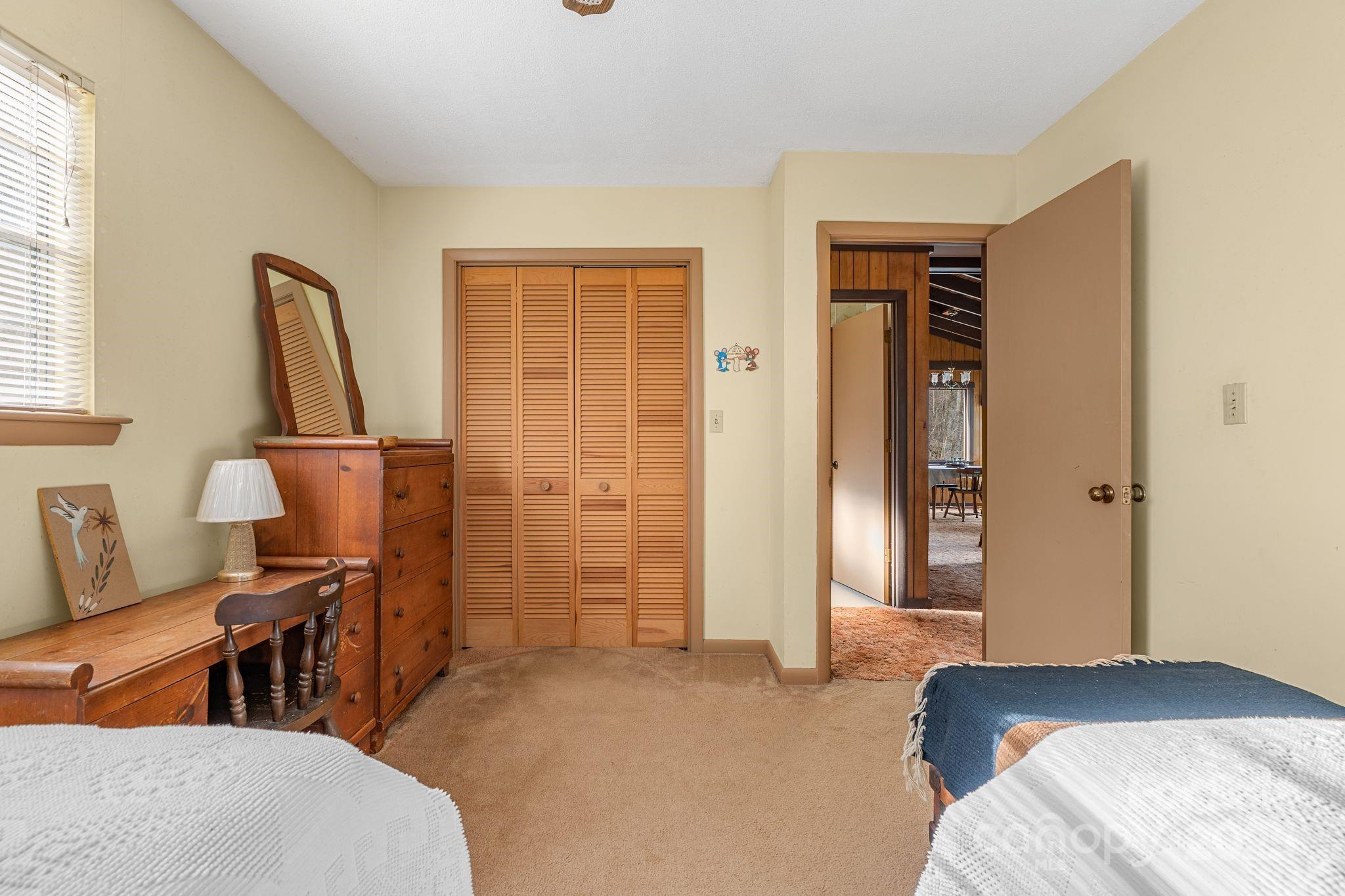 2650 Secluded Valley Road Marshall, NC 28753 - Photo 18 of 36 a bedroom with furniture and a window