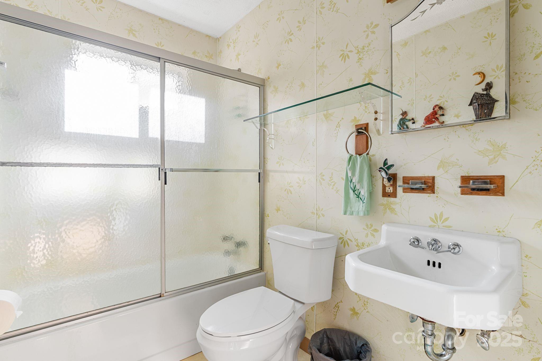 2650 Secluded Valley Road Marshall, NC 28753 - Photo 19 of 36 a bathroom with a sink toilet and shower