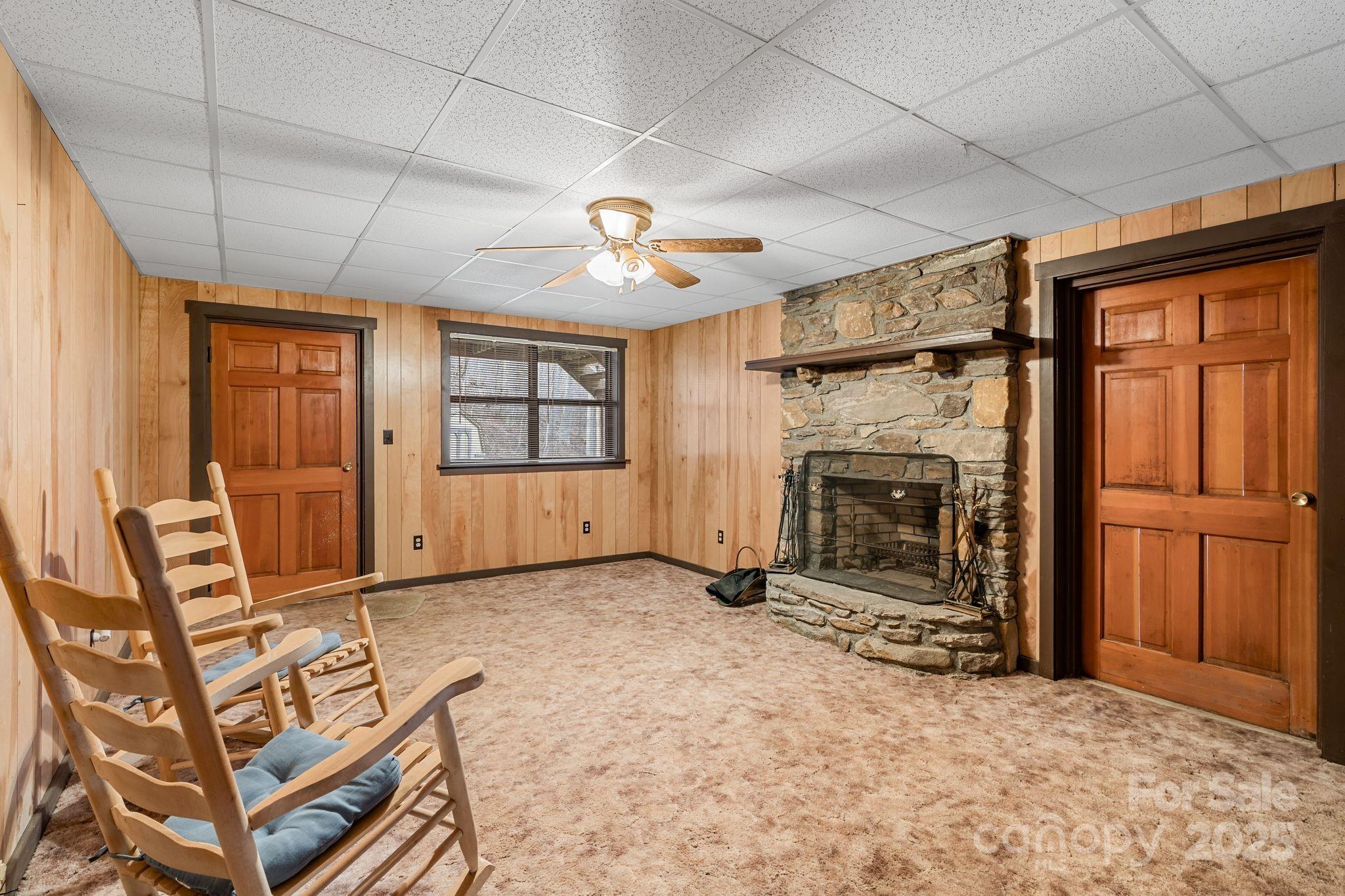 2650 Secluded Valley Road Marshall, NC 28753 - Photo 20 of 36 a view of a livingroom with furniture and a fireplace
