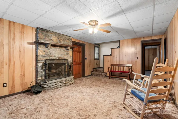 a view of a livingroom with furniture and a fireplace