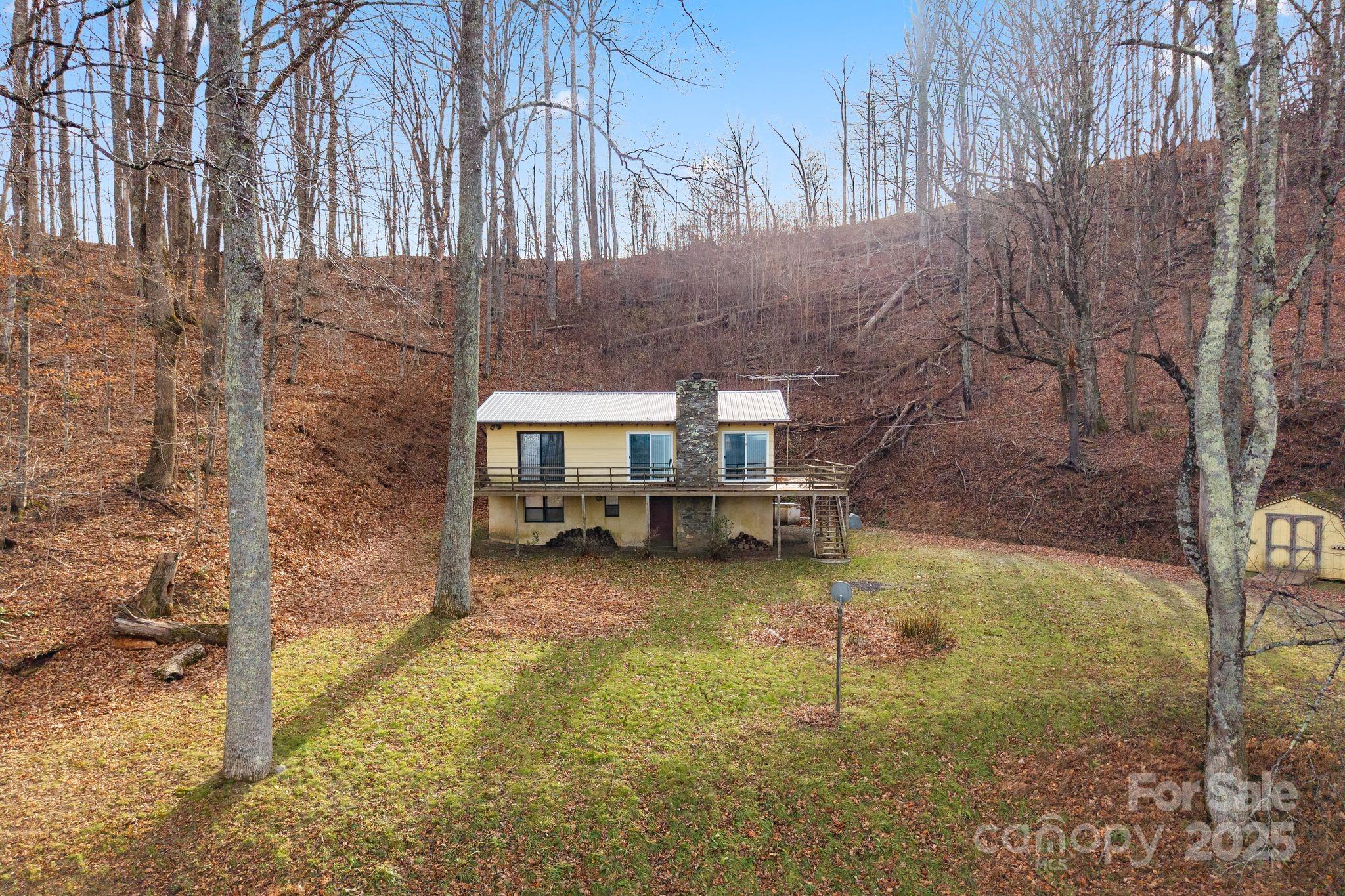 2650 Secluded Valley Road Marshall, NC 28753 - Photo 3 of 36 a view of a house with backyard