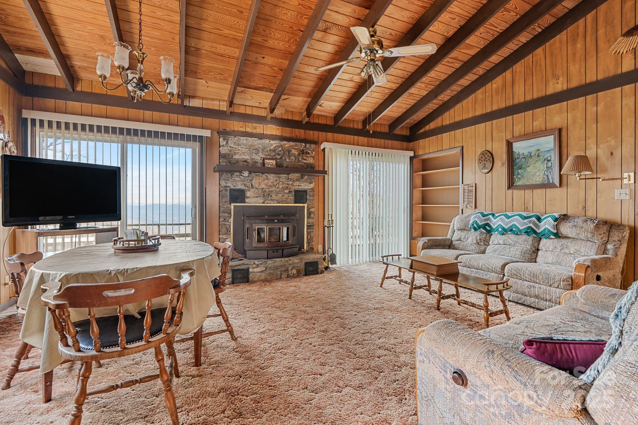 2650 Secluded Valley Road Marshall, NC 28753 - Photo 8 of 36 a view of a livingroom with furniture and a flat screen tv
