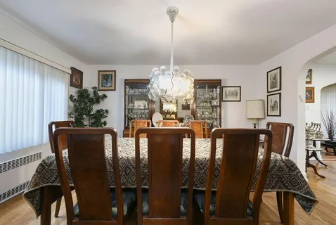 a view of a dining room with furniture and window