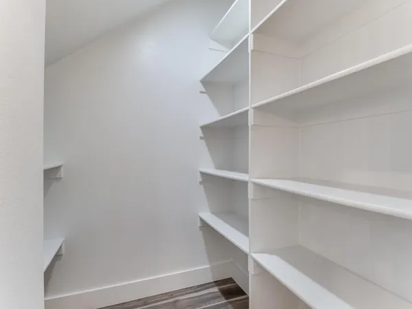 a view of an empty walk in closet