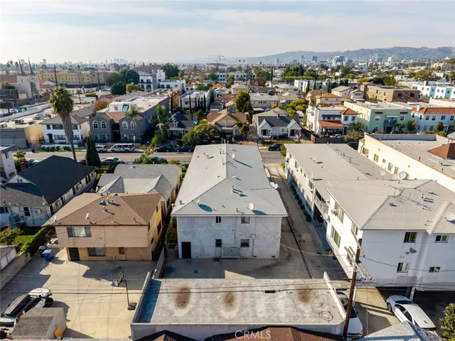 an aerial view of a house with a lot of city