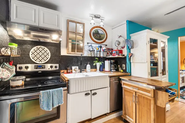 a dinning room with furniture and a chandelier