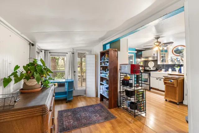 a living room with furniture fireplace and potted plant