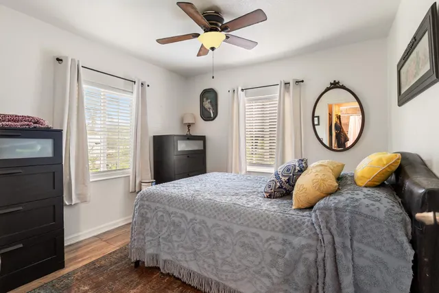 a bedroom with a bed and a window