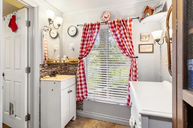 a bathroom with a toilet and a shower curtain