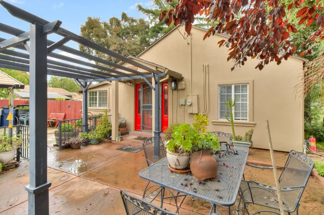 a front view of a house with a garden