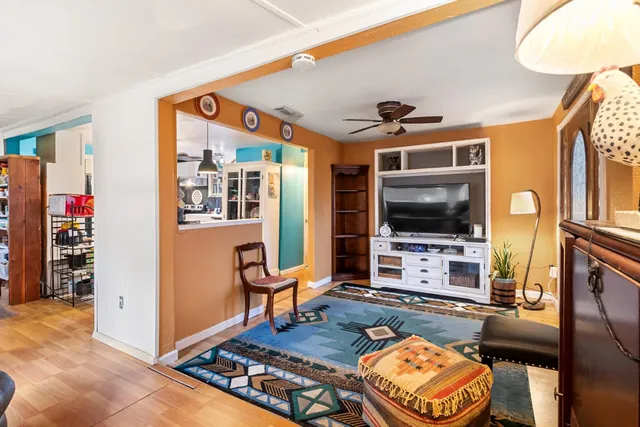 a living room with furniture and a window