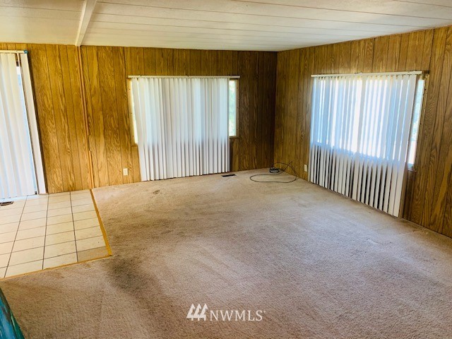 11023 Karshner Road East Edgewood, WA 98372 - Photo 7 of 16 a view of an empty room with a window