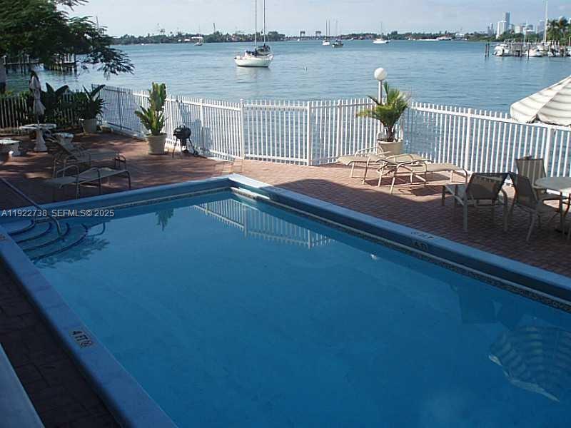 1441 Lincoln Road, Unit 308 Miami Beach, FL 33139 - Photo 3 of 10 a terrace view with seating space and lake view