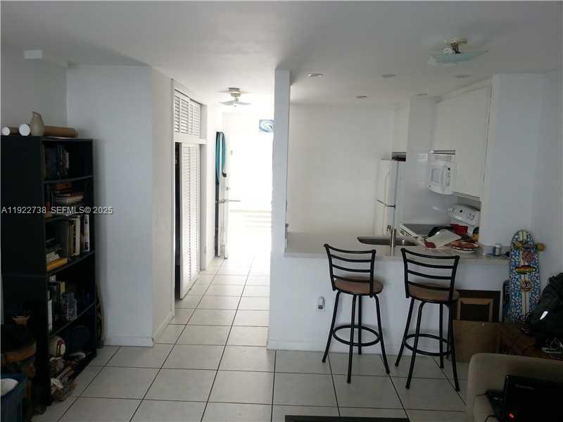 1441 Lincoln Road, Unit 308 Miami Beach, FL 33139 - Photo 4 of 10 a view of a dining room with furniture