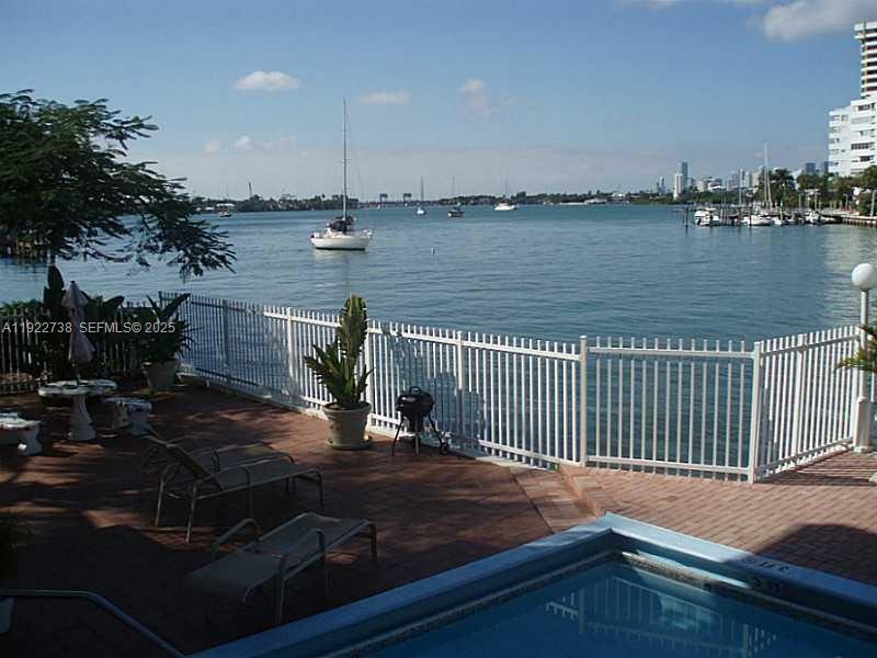 1441 Lincoln Road, Unit 308 Miami Beach, FL 33139 - Photo 5 of 10 a view of a lake with boats and large trees