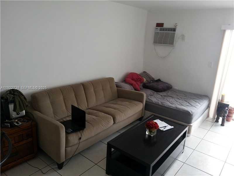 1441 Lincoln Road, Unit 308 Miami Beach, FL 33139 - Photo 8 of 10 a living room with furniture