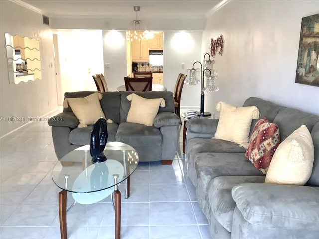 a living room with furniture and a table