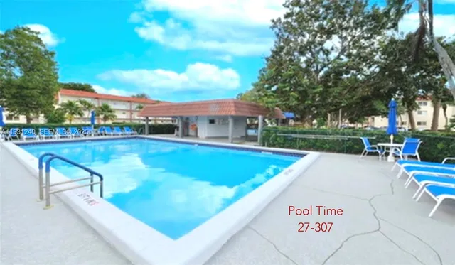 a view of a swimming pool with a patio