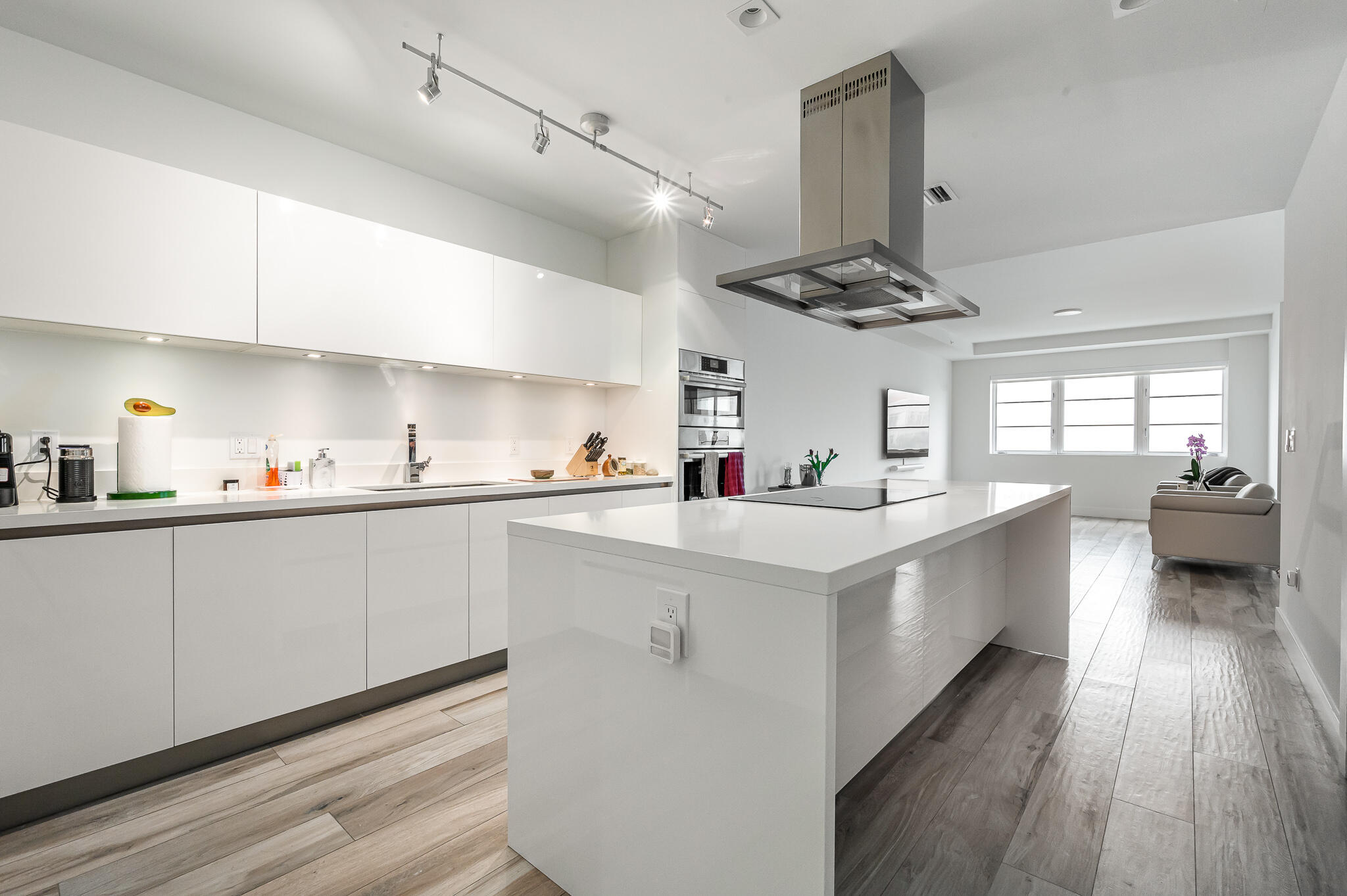 155 East Boca Raton Road, Unit 516 Boca Raton, FL 33432 - Photo 1 of 32 a kitchen with kitchen island a counter top space a sink stainless steel appliances and cabinets