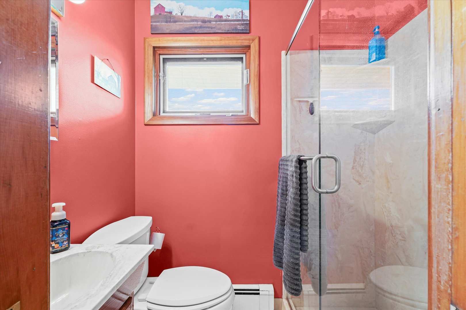 209 West Main Street Royal, IL 61871 - Photo 17 of 32 a bathroom with a toilet sink vanity and shower
