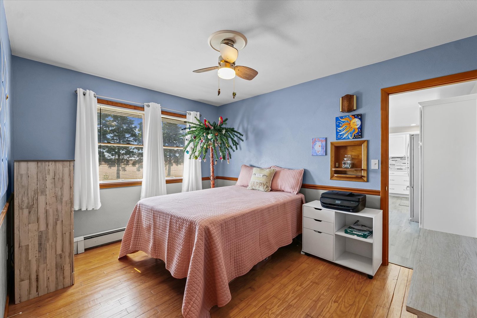 209 West Main Street Royal, IL 61871 - Photo 23 of 32 a bedroom with a bed and a chandelier