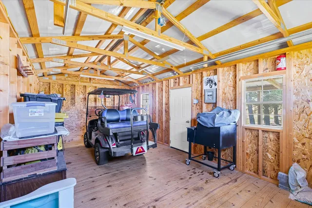 a view of a room with furniture and a window