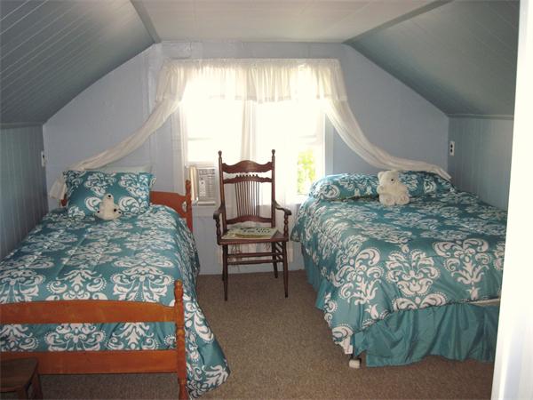 981 Tinkham Road Wilbraham, MA 01095 - Photo 15 of 21 a bed sitting in a bedroom next to a window