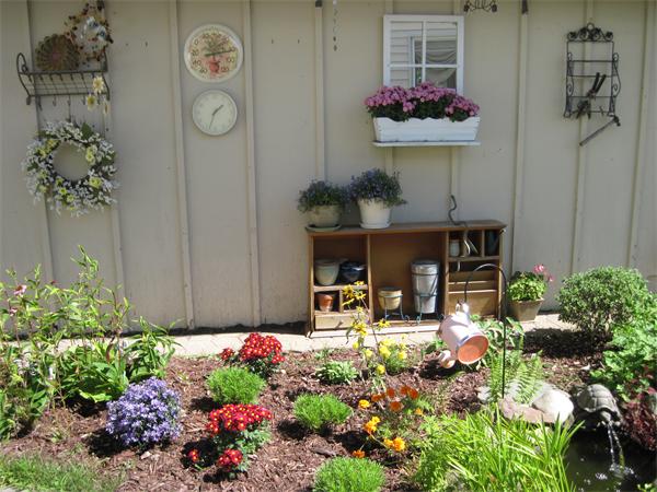 981 Tinkham Road Wilbraham, MA 01095 - Photo 17 of 21 a front view of a house with lots of flowers around