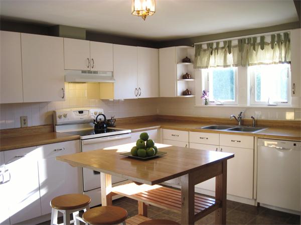 981 Tinkham Road Wilbraham, MA 01095 - Photo 6 of 21 a kitchen with a stove a sink and a refrigerator