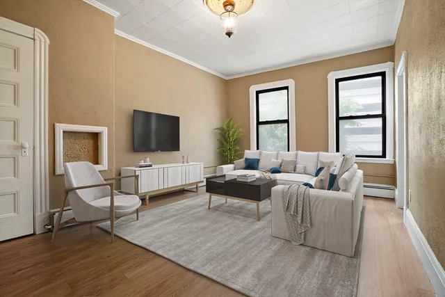 a living room with furniture and a flat screen tv