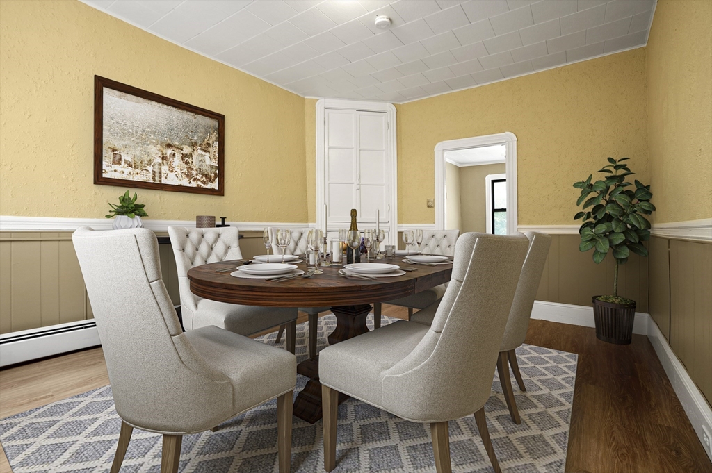 58 Charles Street South, Unit 2 Boston, MA 02116 - Photo 4 of 9 a view of a dining room with furniture and wooden floor