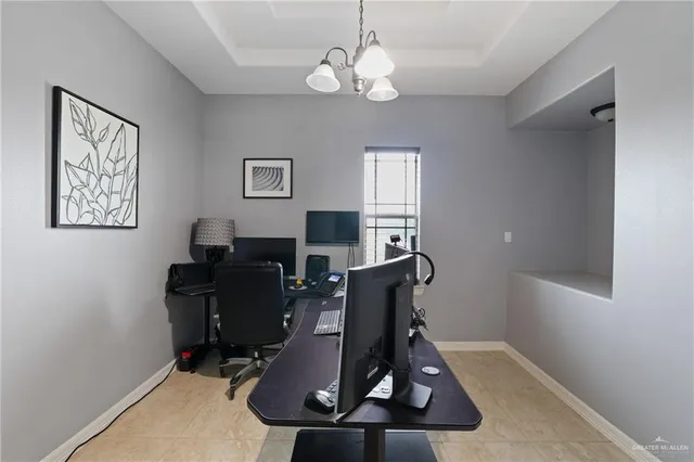 a view of workspace with window and gym equipment