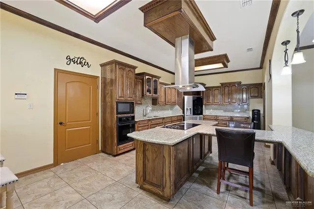 a kitchen with refrigerator and cabinets
