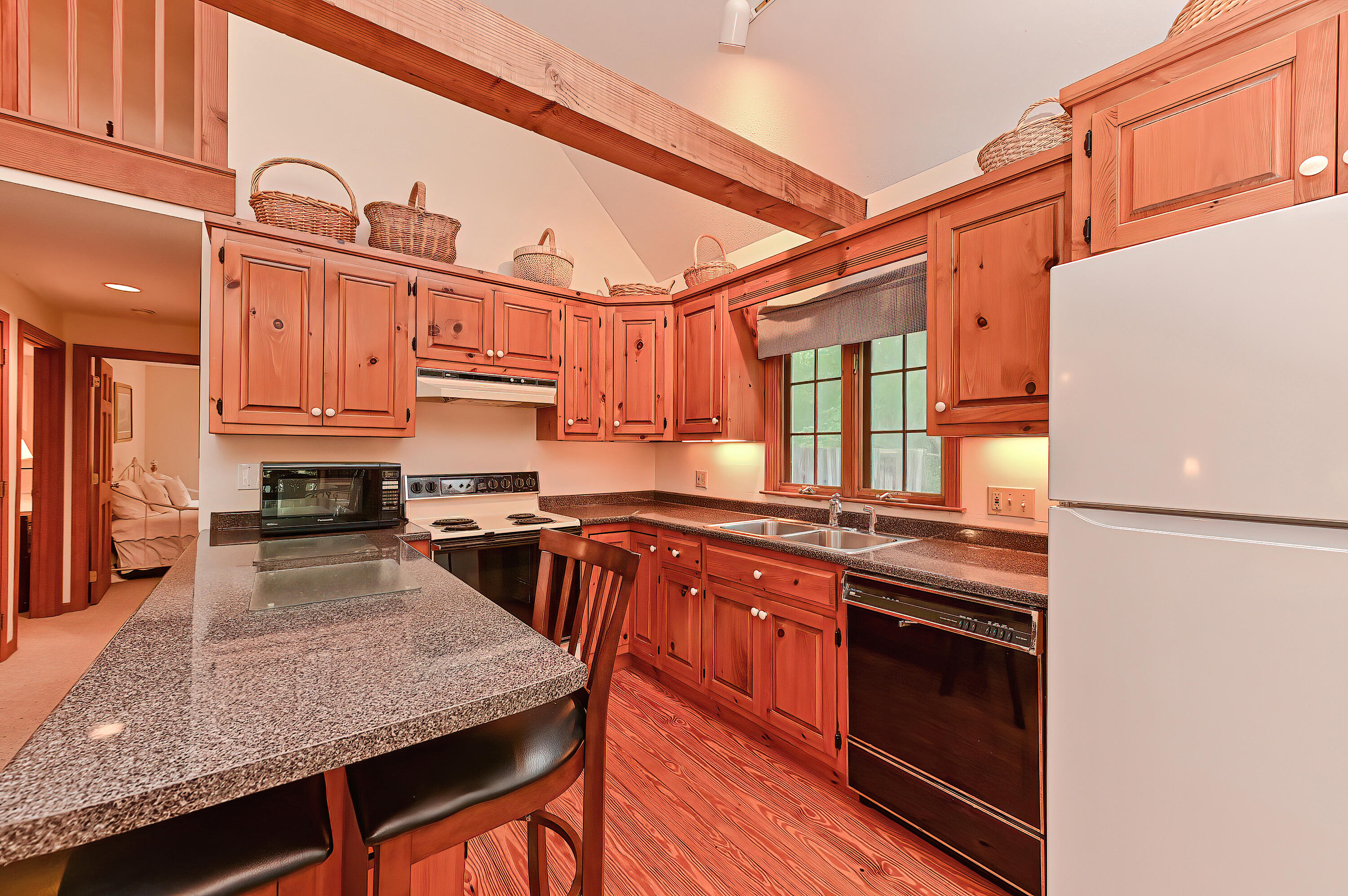 60 Grove Road Eastham, MA 02642 - Photo 11 of 39 a kitchen with stainless steel appliances granite countertop a stove a sink and a refrigerator
