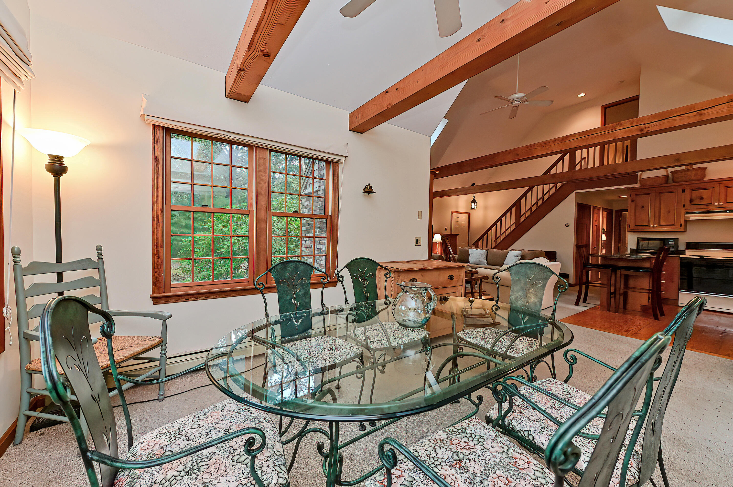 60 Grove Road Eastham, MA 02642 - Photo 14 of 39 a dining room with furniture a rug and a large window