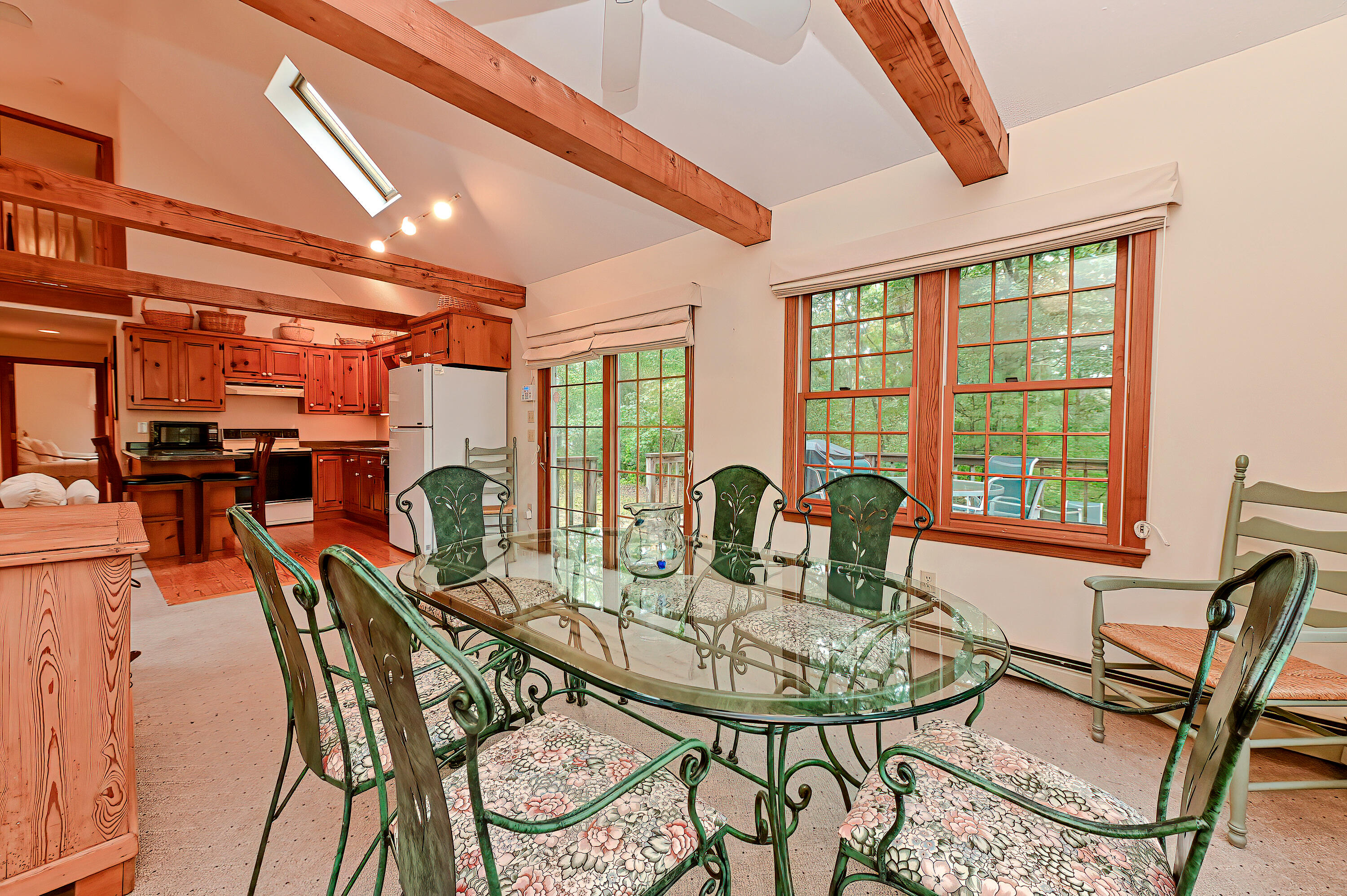 60 Grove Road Eastham, MA 02642 - Photo 15 of 39 a view of a dining room with furniture window and outside view