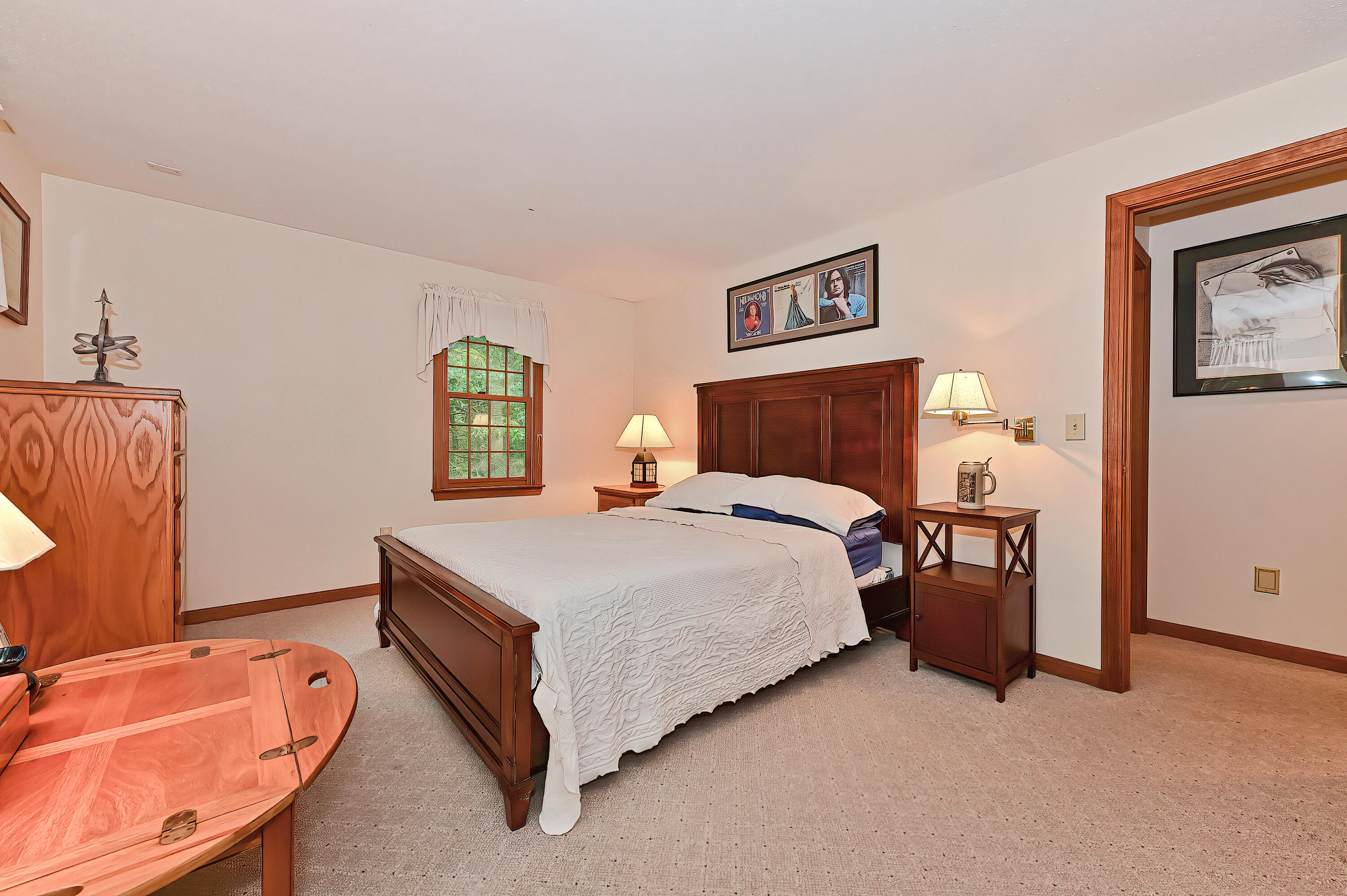 60 Grove Road Eastham, MA 02642 - Photo 16 of 39 a bedroom with a bed and a flat screen tv