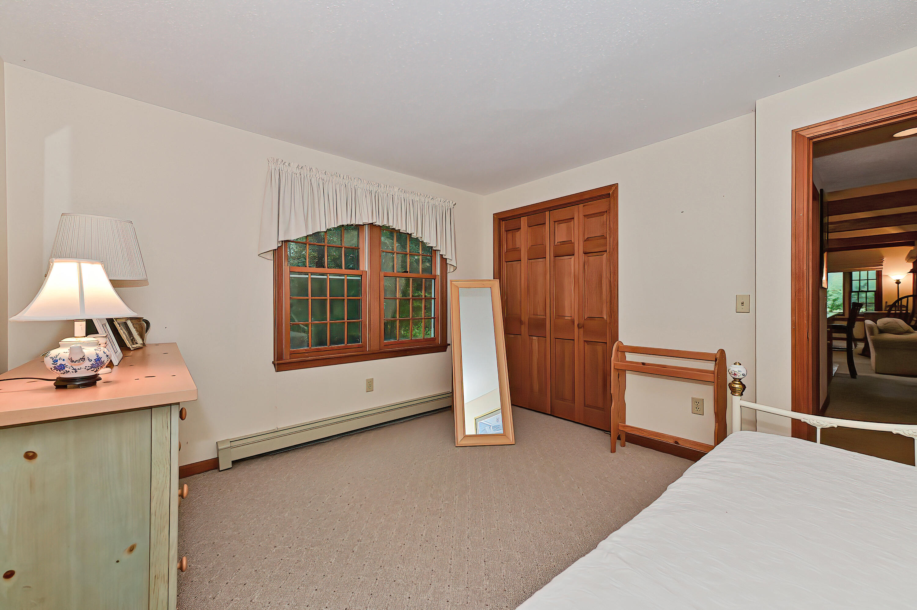 60 Grove Road Eastham, MA 02642 - Photo 20 of 39 a bedroom with a bed and a dresser