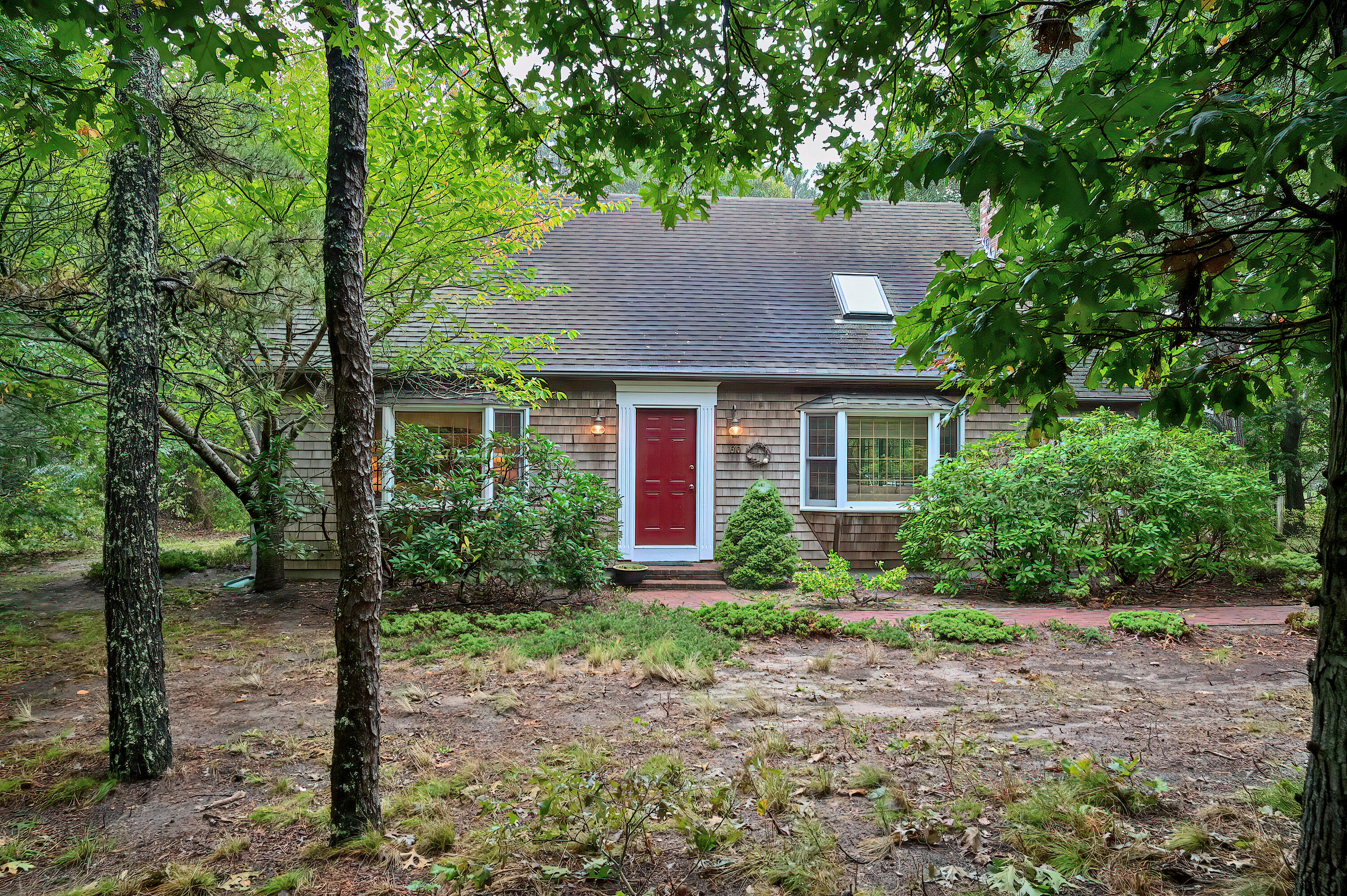 60 Grove Road Eastham, MA 02642 - Photo 2 of 39 a front view of a house with garden