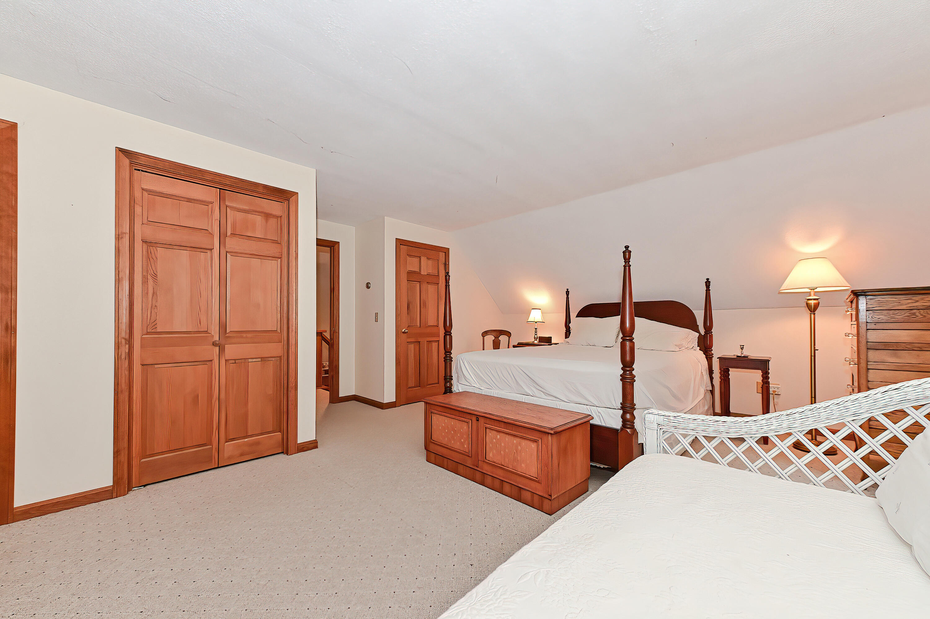 60 Grove Road Eastham, MA 02642 - Photo 26 of 39 a bedroom with three beds and painted walls