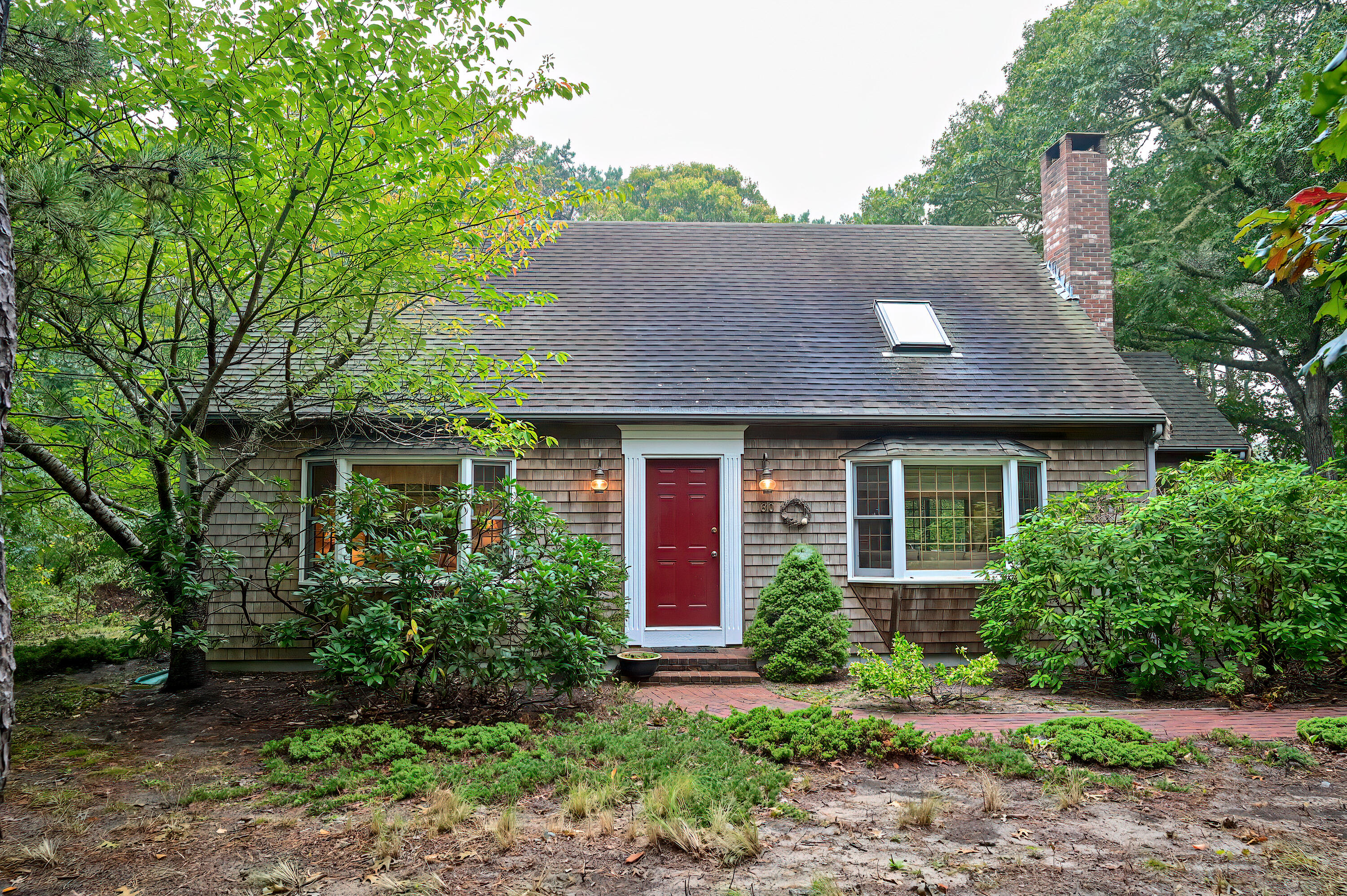 60 Grove Road Eastham, MA 02642 - Photo 3 of 39 front view of a house with a yard