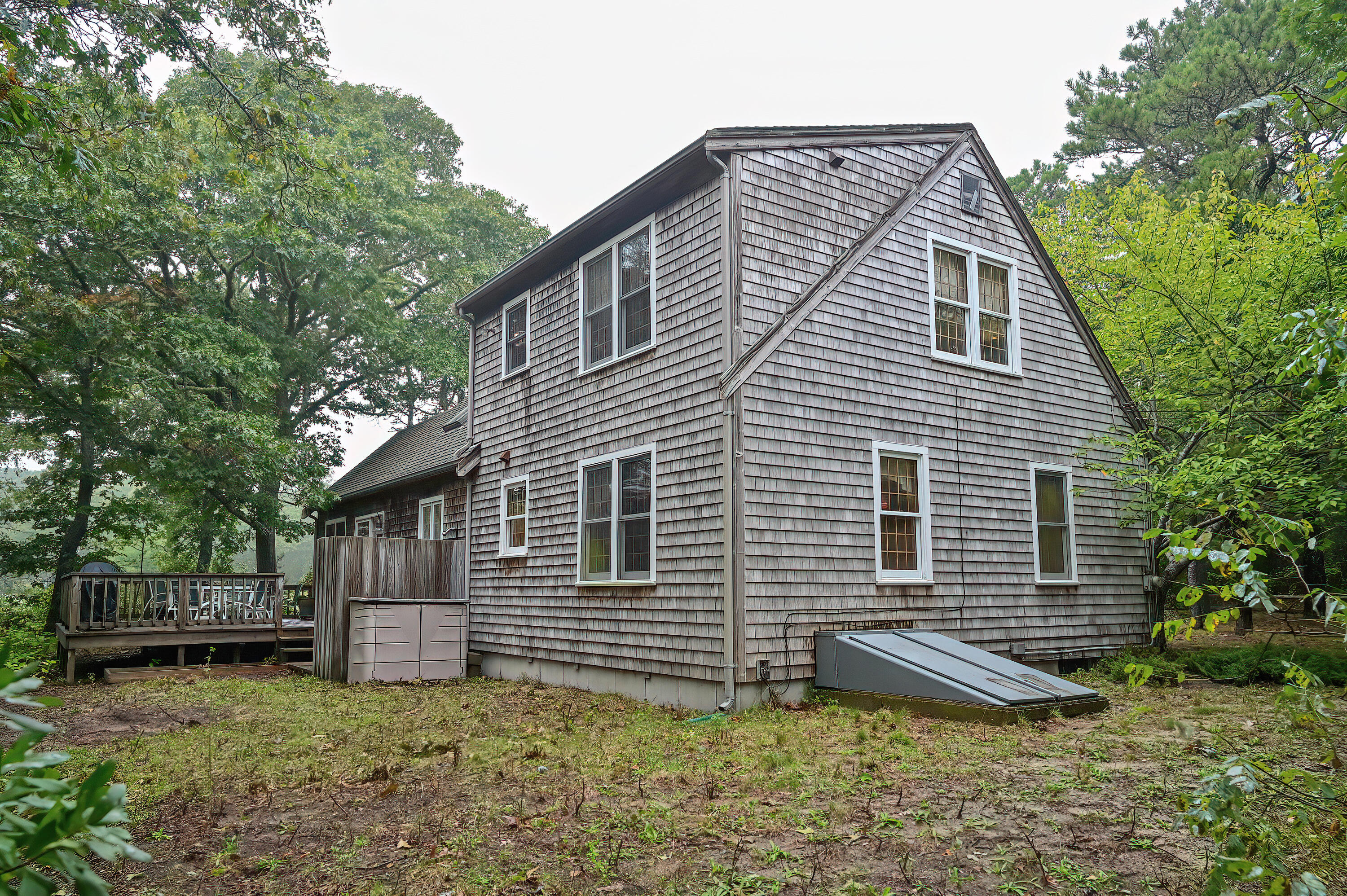 60 Grove Road Eastham, MA 02642 - Photo 5 of 39 a view of a house with a yard