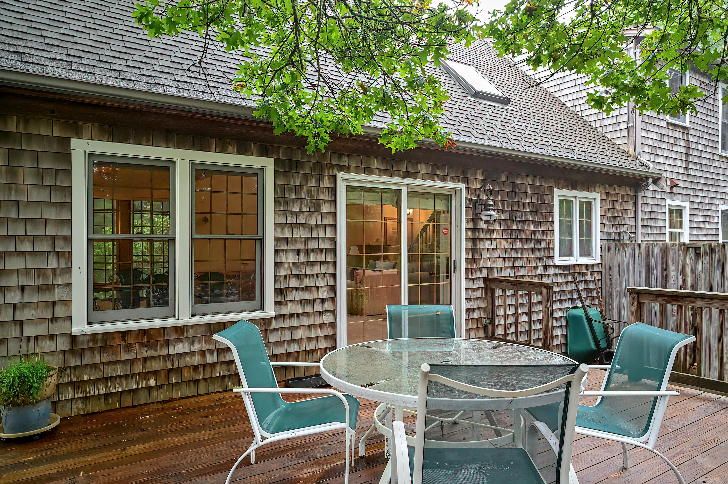 60 Grove Road Eastham, MA 02642 - Photo 6 of 39 a view of a patio with table and chairs