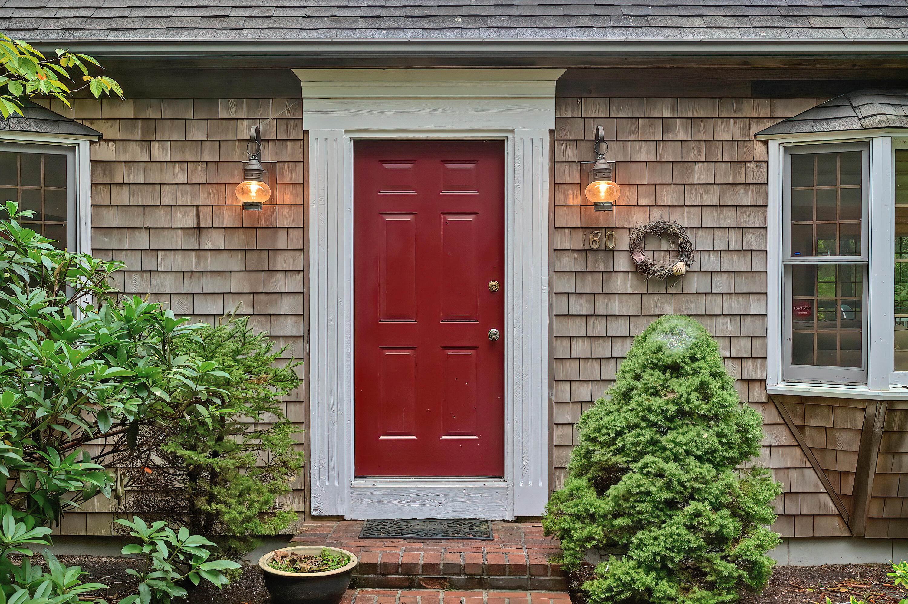 60 Grove Road Eastham, MA 02642 - Photo 7 of 39 a view of a door of the house and outdoor space