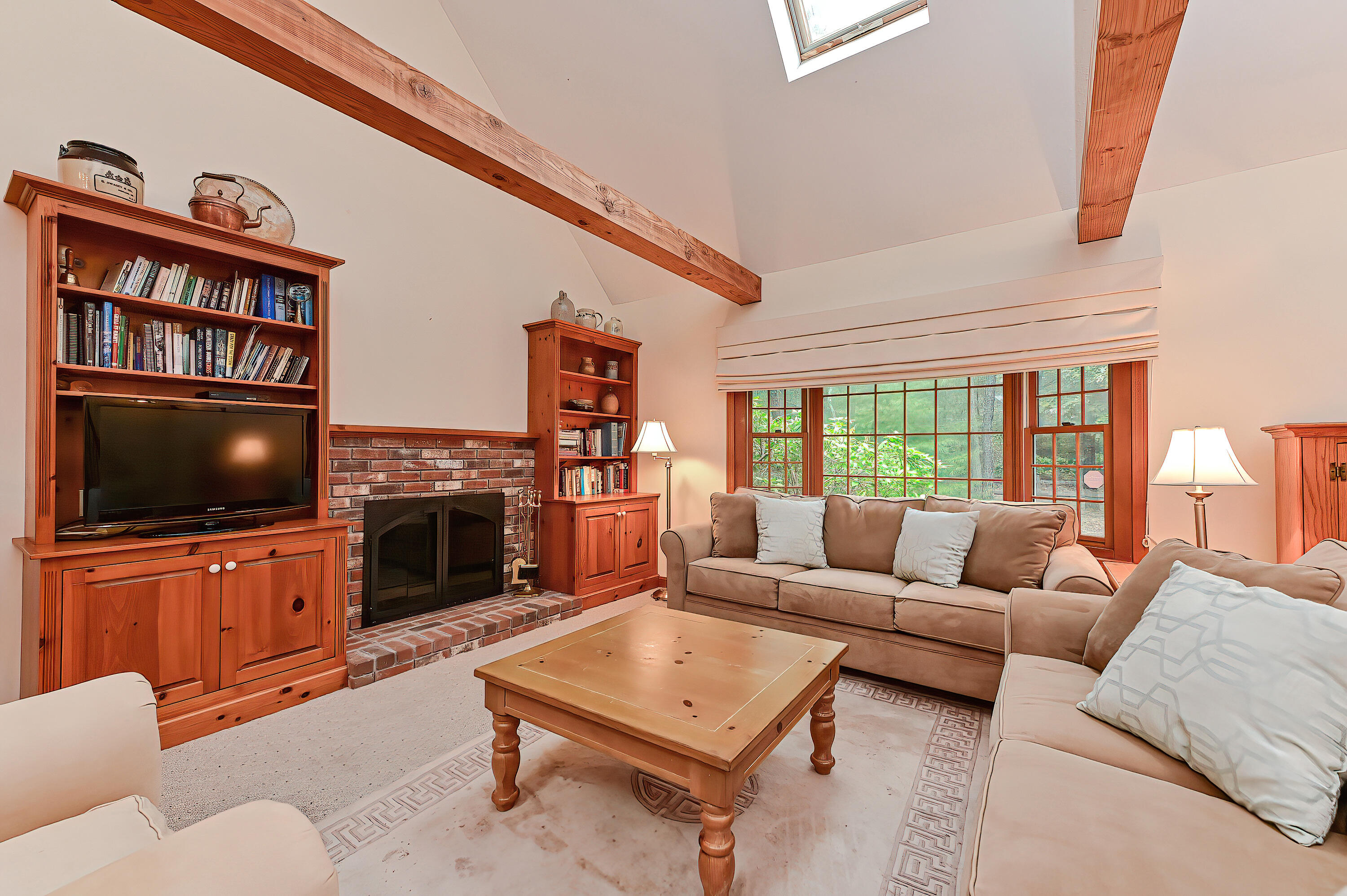 60 Grove Road Eastham, MA 02642 - Photo 10 of 39 a living room with furniture and a flat screen tv