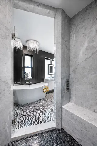 a bathroom with a bathtub and a sink