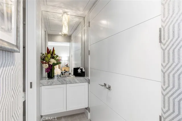 a bathroom with a sink and mirror