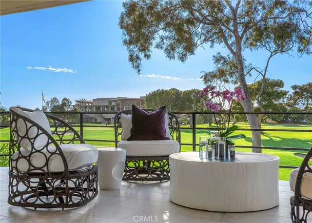 a view of a swimming pool with a patio and a garden