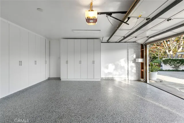 a view of empty room with floor to ceiling windows
